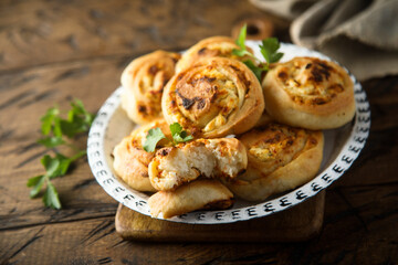 Homemade cheese buns with herbs
