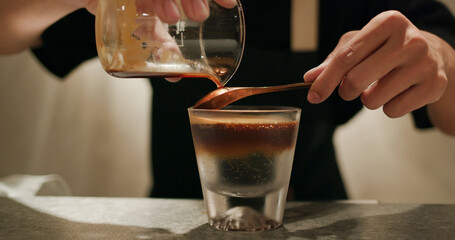 Pour espresso coffee into tonic water, mock tail beverage