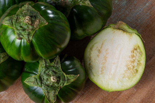 Scarlet eggplant on a wooden board. 