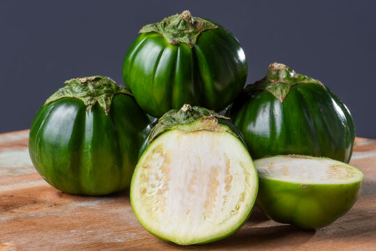 Scarlet eggplant on a wooden board. 