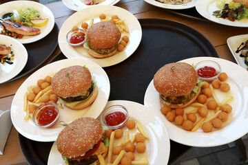 Plates with burgers on tray