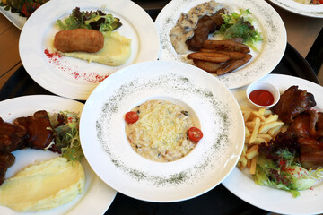 Plates with various dishes on tray