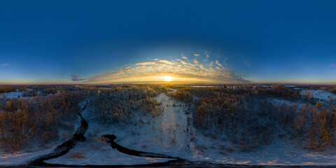 An aerial drone view of the frozen Jagala river, Estonia at sunset 360 degrees panorama. Winter landscape.