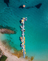 Amazing aerial view over one of the best beaches in Protaras, Cyprus. Yellow sand, blue and turquoise water - perfect summer getaway, luxury vacation in Mediterranean 