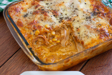 Traditional italian lasagna with cheese. On a wooden background.