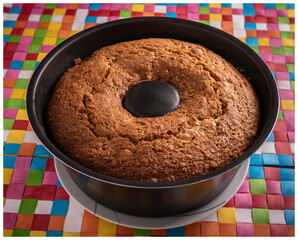 brazilian apple cake on a colored table
