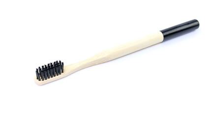 Bamboo toothbrush on white background