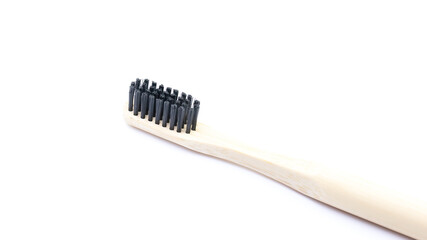 Toothbrush in wood on a white background isolate