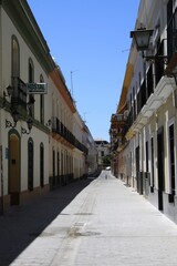 Fototapeta premium An old narrow street in the center of Seville