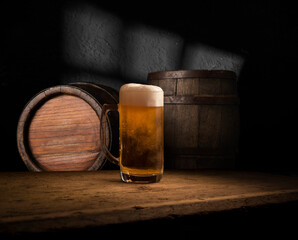 Beer style- bottle, beer in the glass and covers on wooden table. Free space for text. Top view