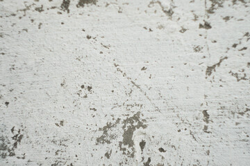 Damaged cement wall with white paint. Copy space