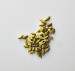 Top view shot of cardamom on white background.