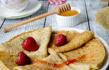 pancakes with strawberry, jam and honey