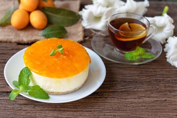  Marian Plum or Plango cheese cake for tea time on rustic vintage old wood table.
