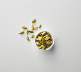 Top view shot of cardamom on white background.