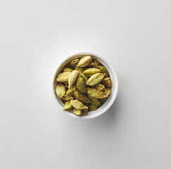 Top view shot of cardamom on white background.