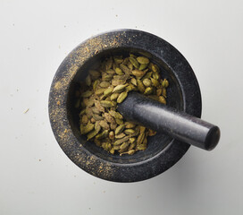 Top view shot of cardamom on white background.
