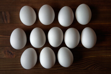 Eggs on a wooden table. View from above.
