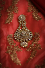 intricately designed with white stone anarkali jhoomar an head wear of the Pakistani and Indian Muslim brides