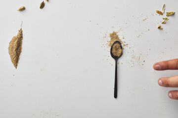 Top view shot of cardamom on white background.