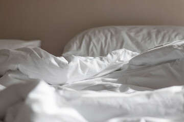 White mattress in the morning with the light lay on the bed.