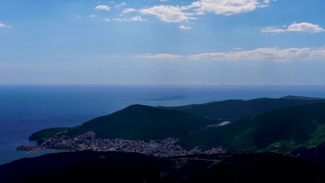 Timelapse of Montenegro coast, view from the mountains. Beautiful clouds and blue adriatic sea