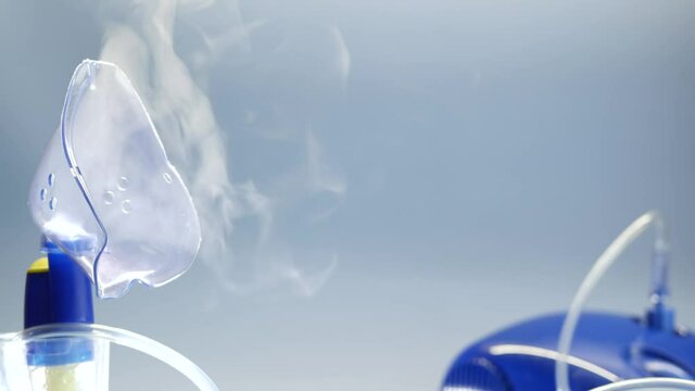 Oxygen mask of nebulizer, medical equipment for pneumonia, covid, sars and bronchitis treatment. Nebuliser inhaler, respiratory and pulmonary disease recovery. Flu, cough and bronchial asthma therapy.