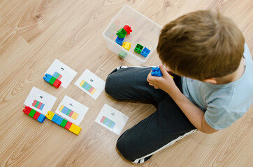 Child learning to count with blocks.