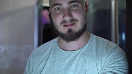 Bearded Young Man Blows A Kiss and Winks With An Eye. The concept of male flirting, flirting, love.