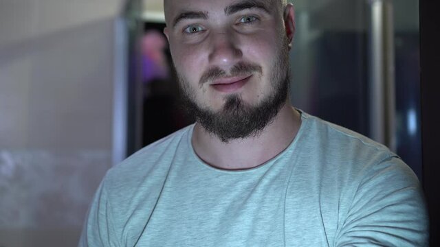 Bearded Young Man Blows A Kiss and Winks With An Eye. The concept of male flirting, flirting, love.