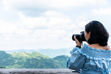 Obraz premium Tourists taking photo of natural scenery
