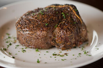 Steak. Grass-fed skirt steak, grilled to a medium rare and served with a garlic herb butter sauce and paired with roasted potatoes and Brussels sprouts. Classic American steakhouse favorite.