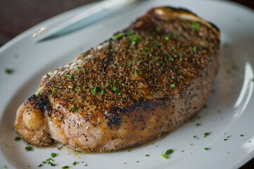 Steak. Grass-fed skirt steak, grilled to a medium rare and served with a garlic herb butter sauce and paired with roasted potatoes and Brussels sprouts. Classic American steakhouse favorite.