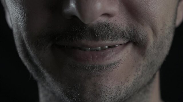 Young man close up shot of lips with brace. Dental, orthodontic concept braces and teeth concept.