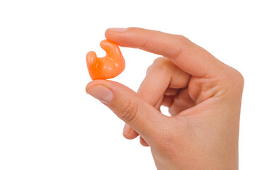 Isolated on white earplug in female hand. Personally molded earplugs close-up. Part of the set