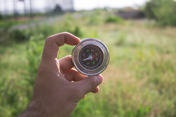 compass against grass background