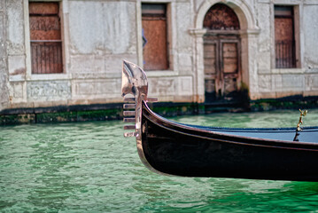 Fototapeta na wymiar Canal with gondolas in Venice, Italy. Close-up.