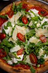 Pizza. Traditional New York City style margarita pizza pie with a thin homemade crispy crust, fresh tomato garlic marinara sauce topped with buffalo mozzarella cheese and fresh basil leaves.