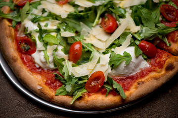 Pizza. Traditional New York City style margarita pizza pie with a thin homemade crispy crust, fresh tomato garlic marinara sauce topped with buffalo mozzarella cheese and fresh basil leaves.