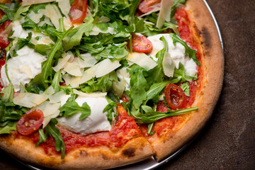 Pizza. Traditional New York City style margarita pizza pie with a thin homemade crispy crust, fresh tomato garlic marinara sauce topped with buffalo mozzarella cheese and fresh basil leaves.