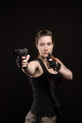 A girl with a waist-high view holds pistols in both hands and aims them at the side.