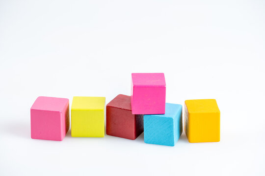 Close-up Of Multi Colored Toy Blocks Against White Background