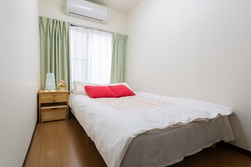 Single bed in modern small bedroom at apartment