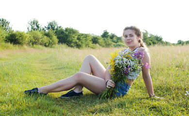 Fototapeta premium Happy girl with long hair walking in the spring