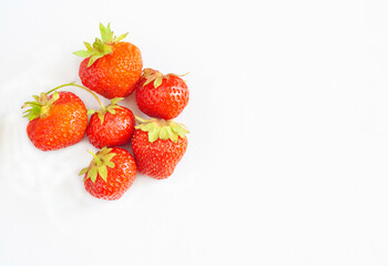Six strawberries isolated on a white background, copy space