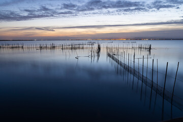 Sunset over the lake, with fising nets. Albufera, Valencia, Spain