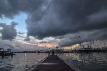 Fototapeta na wymiar Valencia Harbour with moody sky