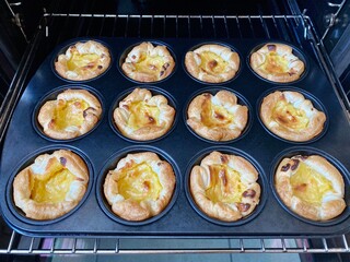 Portugese pastries - pasteis de nata fresh from the oven. Delicious home made cuisine that is typical for the Lisbon region.