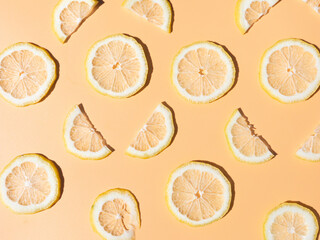 Many slices of lemon isolated on light background