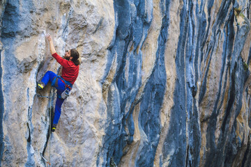 A strong man climbs a rock, Rock climbing in Turkey.